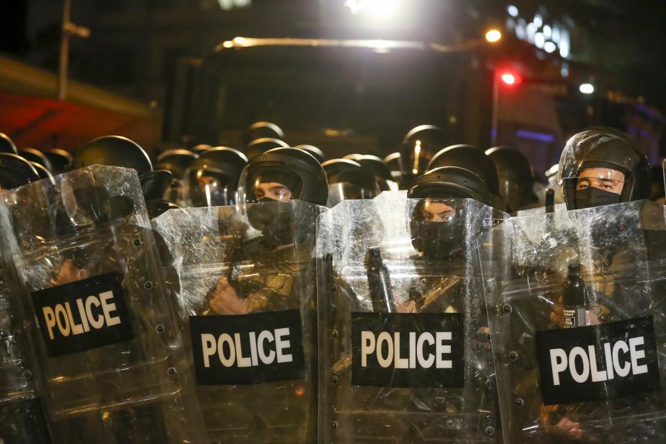 Riot police block opposition protesters who gather to protest against "the Russian law" in Tbilisi, Georgia, on Tuesday, April 30, 2024. Clashes erupted between police and opposition demonstrators protesting a new bill intended to track foreign influence that the opposition denounced as Russia-inspired. (AP Photo/Zurab Tsertsvadze)