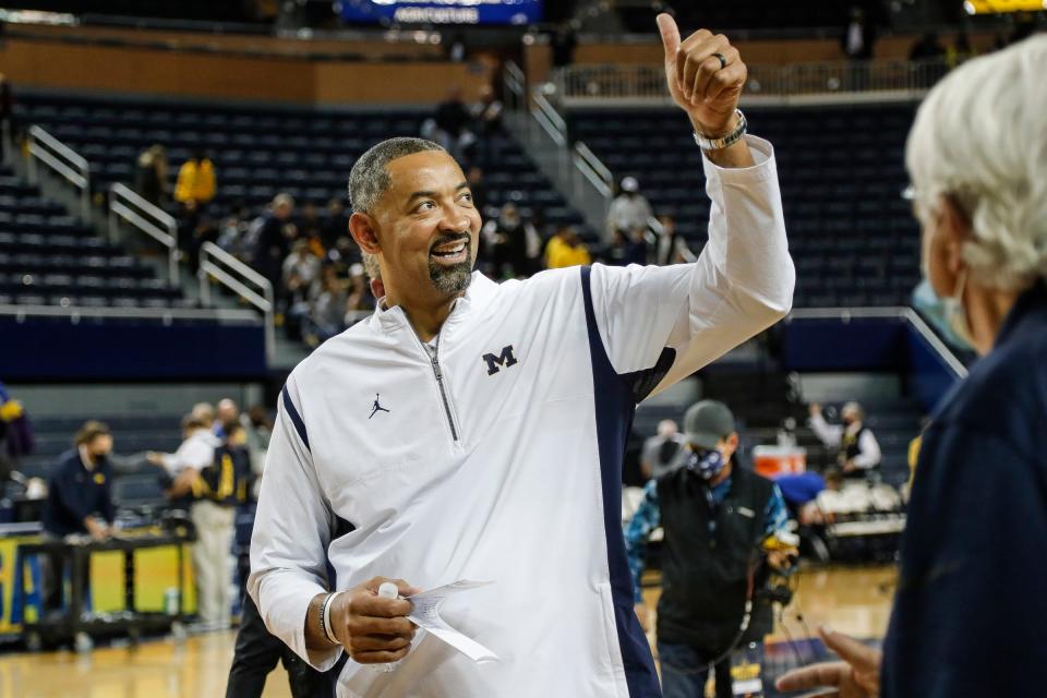 Michigan head coach Juwan Howard celebrates an 88-76 win over Buffalo at the Crisler Center in Ann Arbor on Wednesday, Nov. 10, 2021.