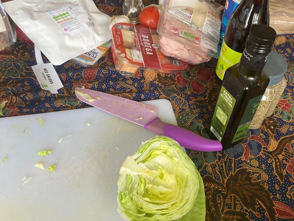 A picture of iceberg lettuce on a chopping board.