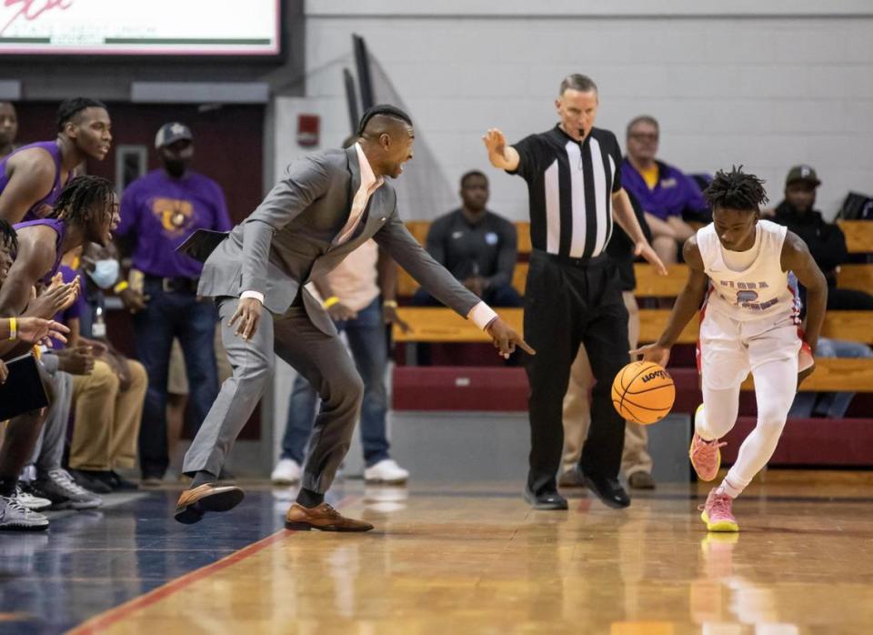 Carlos Powell of Wilson High School points to the foot of Adonis McDaniel of AC Flora as McDaniel makes his way down the sideline during the SCHSL Class 4A Boys Basketball State Championship at the USC Aiken Convocation Center on Saturday, March 5, 2022.