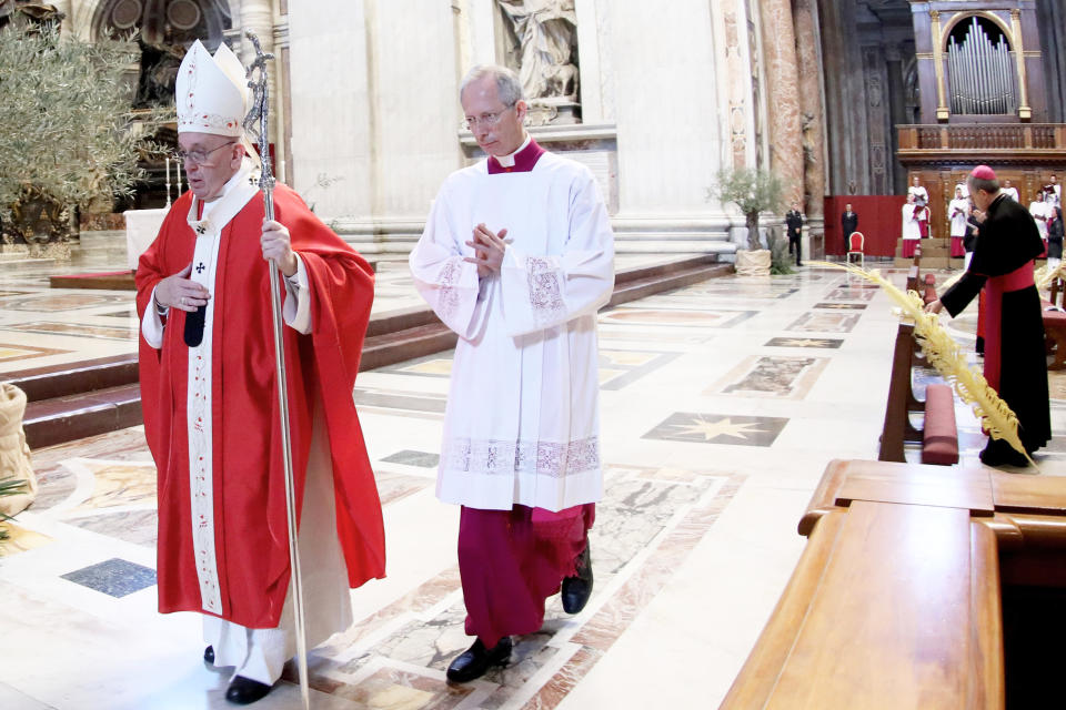 VATICAN CITY, VATICAN - APRIL 05: Pope Francis celebrates the Palm Sunday Mass behind closed doors inside St. Peter’s Basilica at the Vatican during the lockdown due to the spreading of the COVID-19 Coronavirus pandemic, on April 05, 2020 in Vatican City, Vatican. For the first time in history, Pope Francis celebrated Palm Sunday Mass alone in St Peter’s Basilica. Out of respect for Covid-19 regulations limiting large gatherings, the Mass was held without a congregation. Millions of people joined the Holy Father, however, via the internet, radio and television. (Photo by Vatican Pool - Corbis/Getty Images)