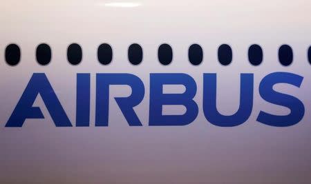 The logo of Airbus is pictured on a scale model of an Airbus A350-1000 during its maiden flight event in Colomiers near Toulouse, Southwestern France, November 24, 2016. REUTERS/Regis Duvignau/File Photo