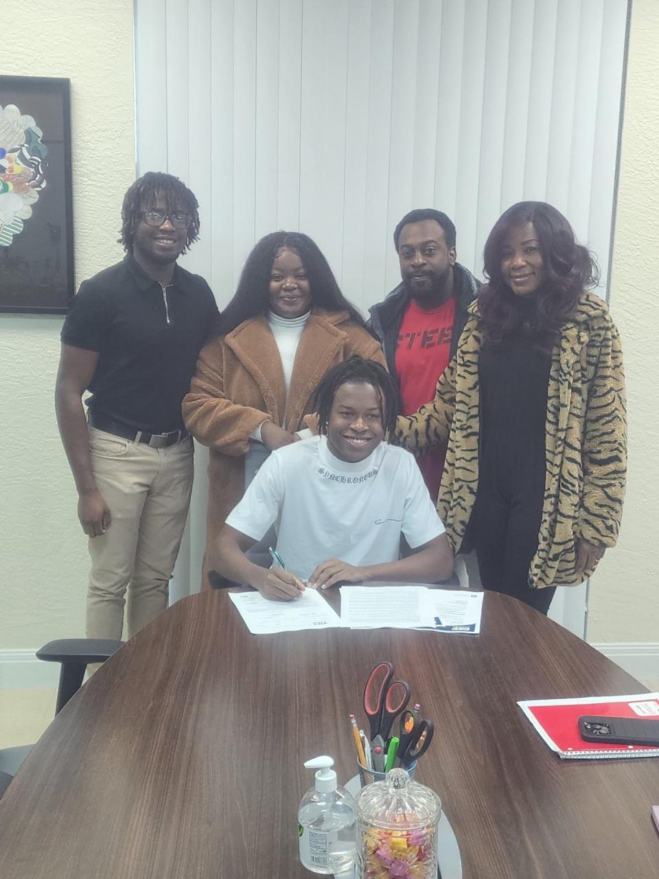 Jensen Beach wide receiver Elvick Previlma signs his college letter of intent to play football at the Concordia University-St. Paul on Wednesday, Feb. 7, 2023 from Jensen Beach High School.