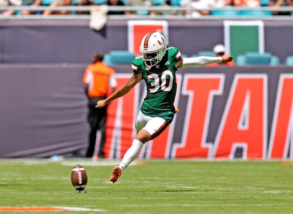 Miami Hurricanes place kicker Andres Borregales (30) kicks the ball on a kickoff during the first quarter of their ACC football game against the Central Connecticut State Blue Devils at Hard Rock Stadium on Saturday, September 25, 2021 in Miami Gardens, Florida.