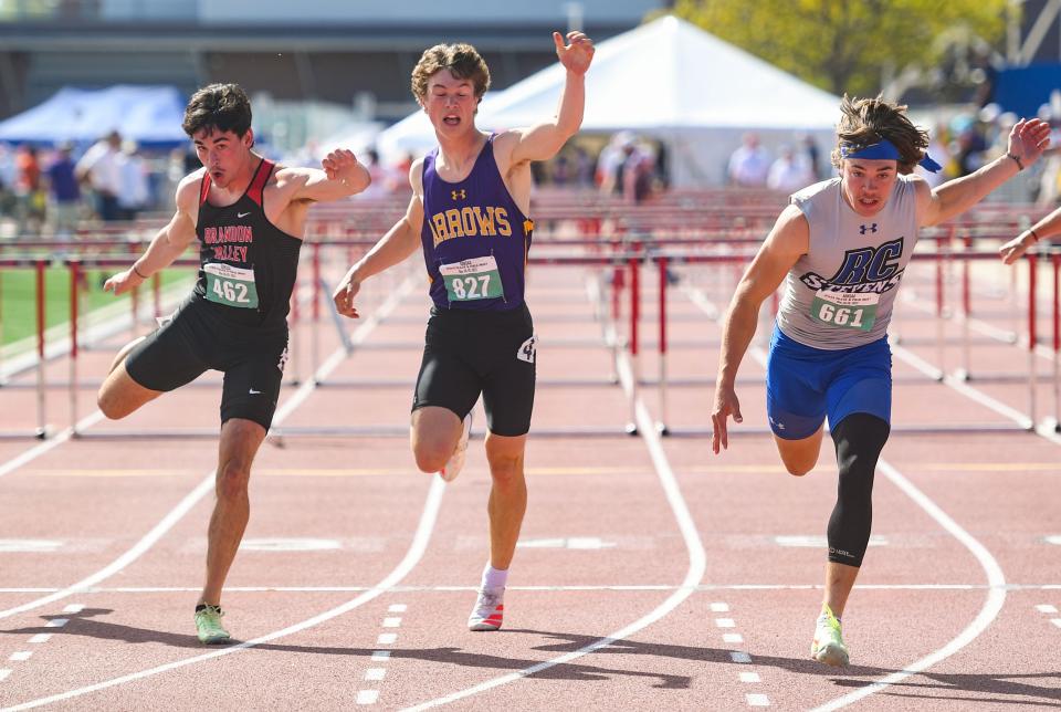 Brandon Valley's Jeremiah Donahoe, Watertown's Collin Dingsor and Rapid City Stevens' Tanner Lunders stumble across the finish line of the 100 meter hurdle race in the final day of the state track meet on Saturday, May 28, 2022, Howard Wood Field in Sioux Falls.