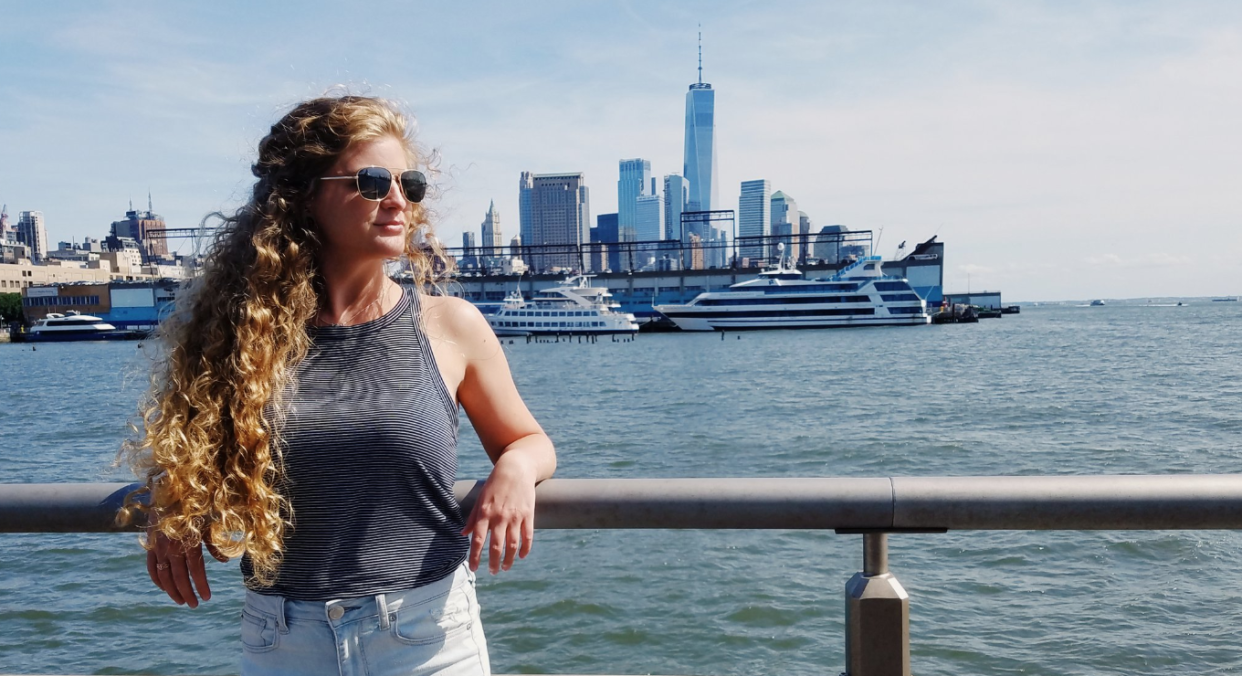 Kaitlin Bennett, pictured in New Jersey with Manhattan in the background, caused controversy when she posed with an AR-10 in her Kent State graduation pictures. (Photo: Kaitlin Bennett via Twitter)