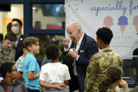 U.S. President Joe Biden eats ice cream as Biden meets with American service members and their family at Osan Air Base, Sunday, May 22, 2022, in Pyeongtaek, South Korea. (AP Photo/Evan Vucci)