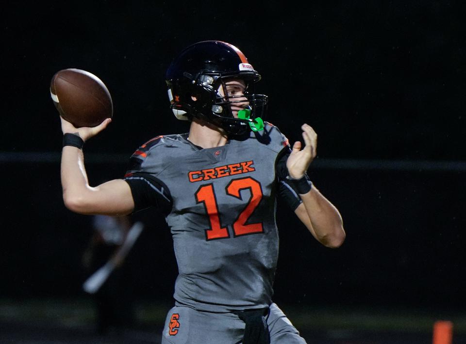 Spruce Creek quarterback Luke Smith (12) looks to pass during a game with Deltona at Spruce Creek High School in Port Orange, Friday, Sept. 1, 2023. 
