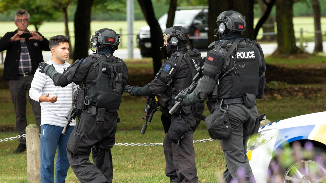 Police push back members of the public following a shooting at the Masjid Al Noor mosque in Christchurch, New Zealand. (Reuters)