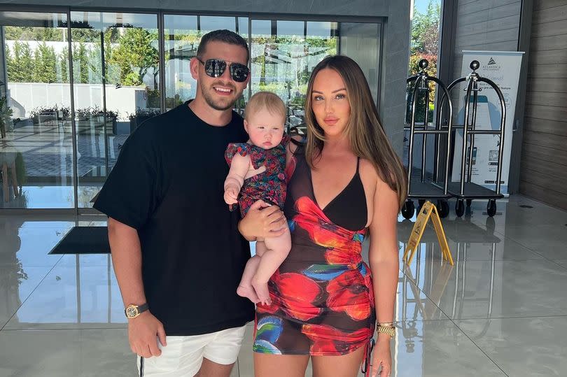 Charlotte Crosby with fiancé Jake and their daughter Alba