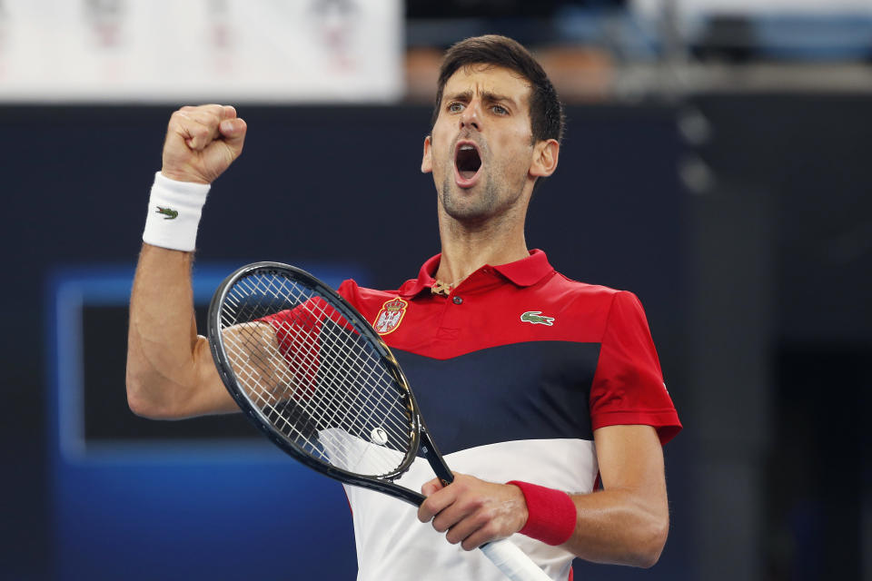 Novak Djokovic of Serbia reacts to winning the first set against Daniil Medvedev of Russia during their ATP Cup tennis match in Sydney, Saturday, Jan. 11, 2020. (AP Photo/Steve Christo)