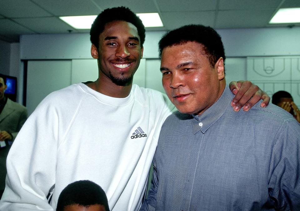 The lifelong Laker also snagged a photo with another legendary athlete and fan, Muhammad Ali.