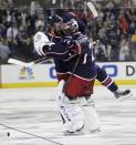 Columbus Blue Jackets' Nick Foligno, left, and Sergei Bobrovsky, of Russia, celebrate Foligno's game-winning goal against the Pittsburgh Penguins in Game 4 of a first-round NHL playoff hockey series on Wednesday, April 23, 2014, in Columbus, Ohio. The Blue Jackets defeated the Penguins 4-3 in overtime. (AP Photo/Jay LaPrete)