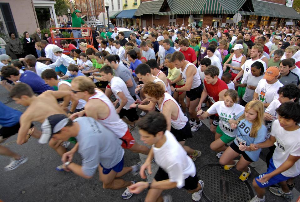 Runners leave the starting line in City Market at the beginning of the March of Dimes 5K Shamrock Run on Friday.