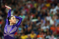 LONDON, ENGLAND - JULY 29: Kyla Ross of the United States competes in the floor exercise in the Artistic Gymnastics Women's Team qualification on Day 2 of the London 2012 Olympic Games at North Greenwich Arena on July 29, 2012 in London, England. (Photo by Ronald Martinez/Getty Images)