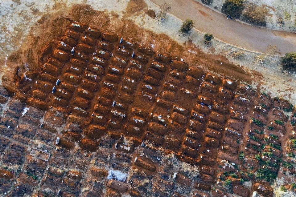 Recently filled graves are seen in the Olifantsveil Cemetery outside Johannesburg, South Africa, Wednesday Aug. 5, 2020. The frequency of burials in South Africa has significantly increased during the coronavirus pandemic, as the country became one of the top five worst-hit nation. New infection numbers around the world are a reminder that a return to normal life is still far from sight. (AP Photo/Jerome Delay)