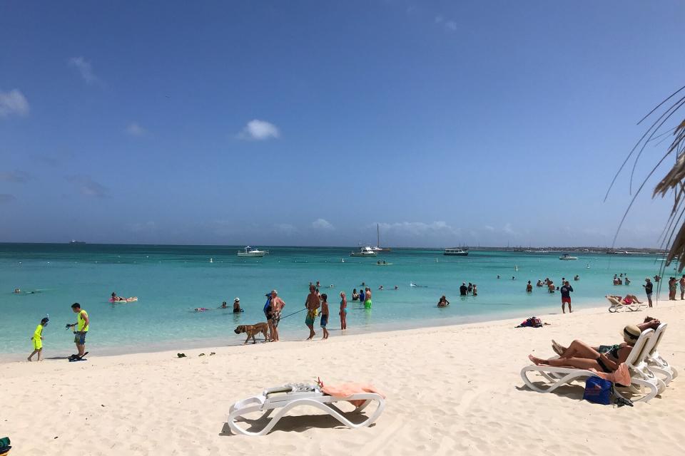 People in the water at Aruba Palm Beach