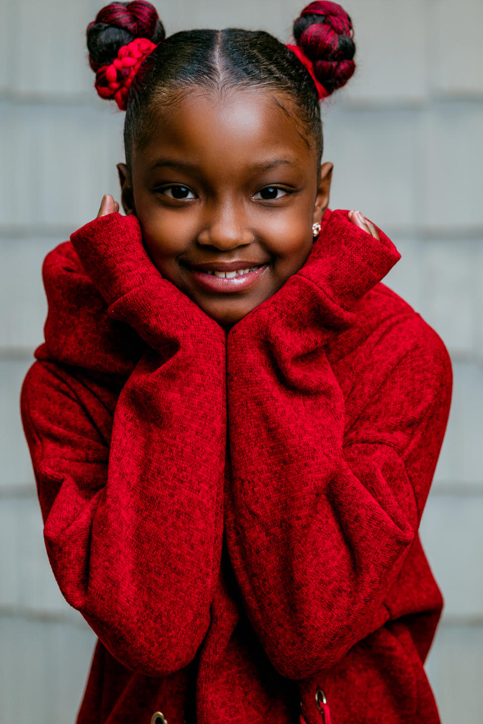 Marian is pictured with her buns with black and red hair extensions. Source: Jermaine Horton