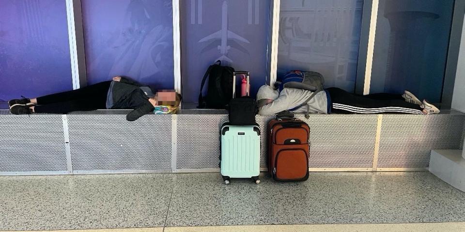 Beth Gill's kids slept on a window ledge at Charlotte airport.