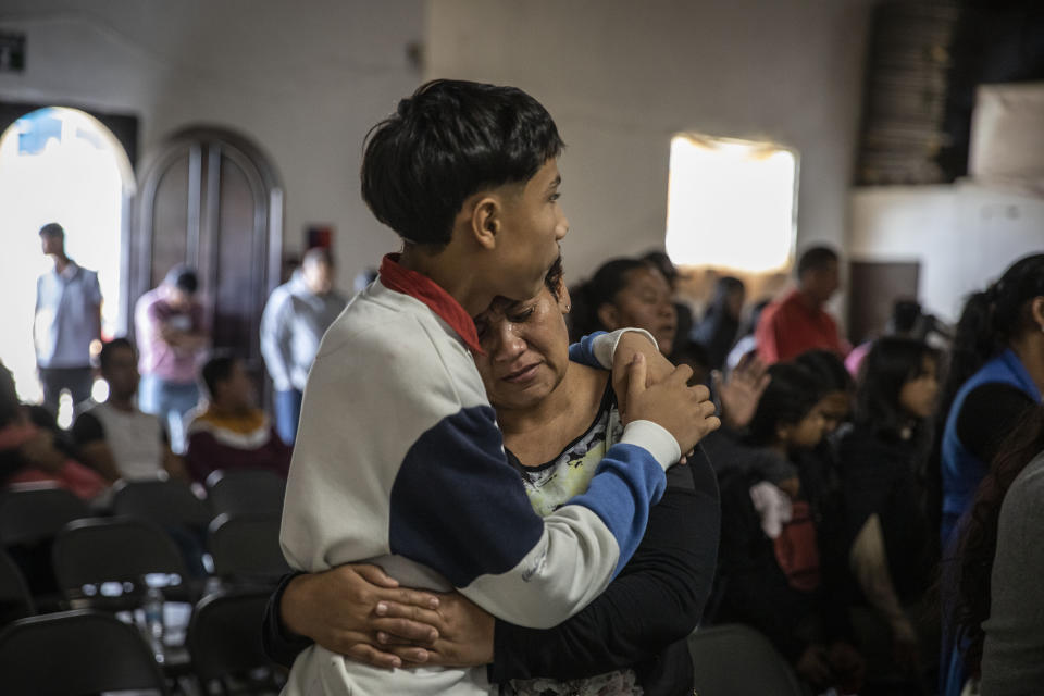 Mexican migrants, many from Michoacan state, attend a religious service at the "Embajadores de Jesus" Christian migrant shelter in Tijuana, Mexico, Tuesday, Sept. 26, 2023. While many places in Mexico provide shelter for migrants from other countries, some shelters in Tijuana have seen an influx of Mexicans fleeing violence, extortion and threats by organized crime. (AP Photo/Karen Castaneda)