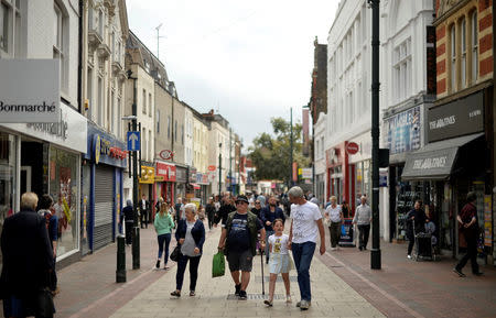 People walk along Chatham High Street in Chatham, Britain, August 8, 2017. . REUTERS/Hannah McKay