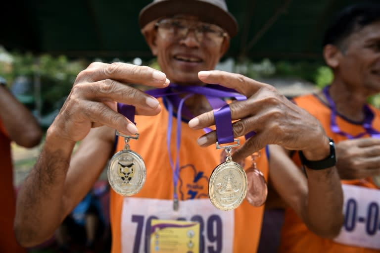 The atmosphere at the Elderly Games was festive, with cheering crowds and athletes helping each other after they crossed the finish line