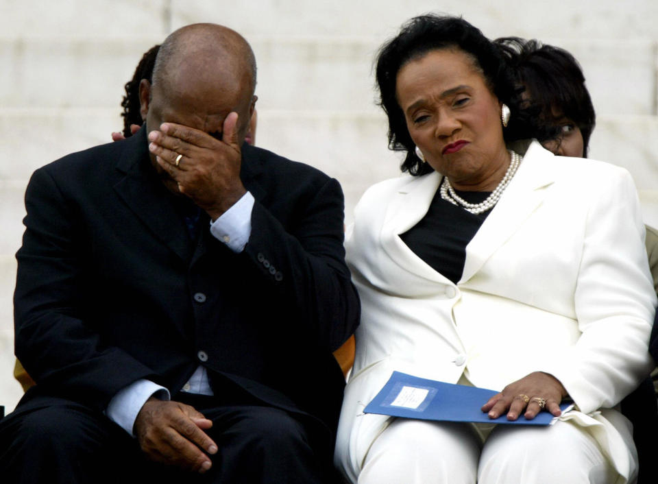 US Rep. John Lewis, D-GA, (L) is comforted by Coretta Scott King (R) after the unveiling of a commemorative granite engraving in honor of slain civil rights leader Dr. Martin Luther King, Jr., 22 August 2003 on the steps of the Lincoln Memorial in Washington, DC where Dr. King gave his 'I Have a Dream' speech nearly 40 years ago. The ceremony was part of a two-day 40th anniversary march on Washington, DC.   AFP PHOTO/PAUL J.RICHARDS  (Photo credit should read PAUL J.RICHARDS/AFP/Getty Images)