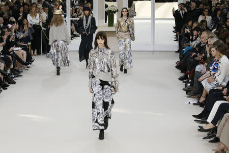 Models present creations by German designer Karl Lagerfeld as part of his Fall/Winter 2016/2017 women's ready-to-wear collection for fashion house Chanel at the Grand Palais in Paris, France, March 8, 2016. REUTERS/Gonzalo Fuentes