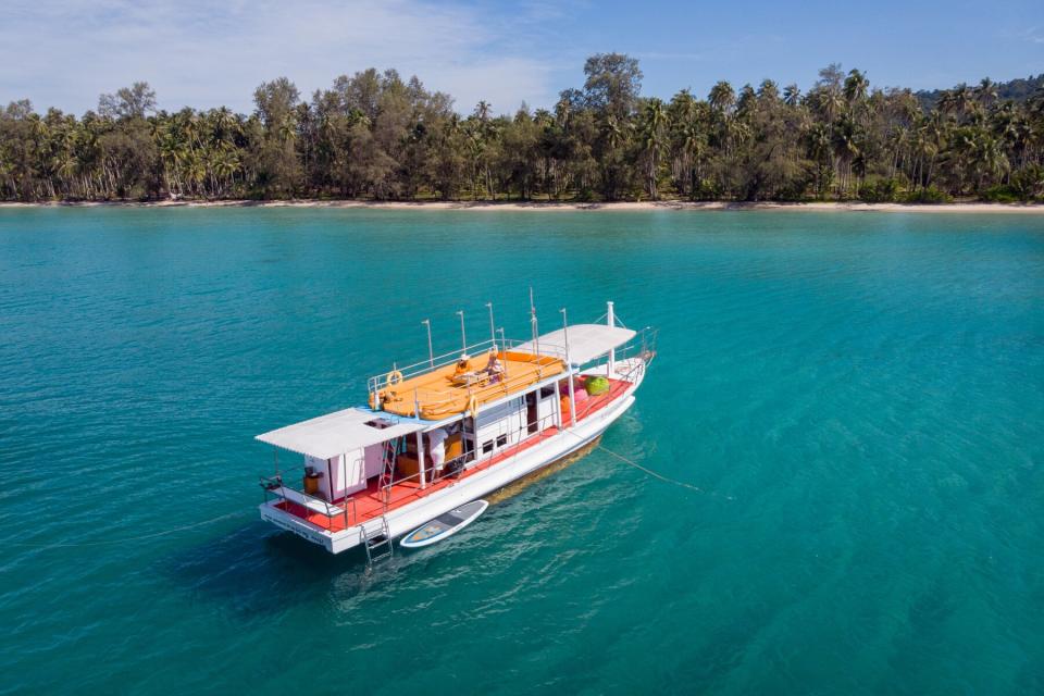 A boat off the beach at Soneva Kiri