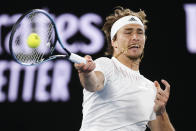 Alexander Zverev of Germany plays a forehand return to compatriot Daniel Altmaier during their first round match at the Australian Open tennis championships in Melbourne, Australia, Monday, Jan. 17, 2022. (AP Photo/Hamish Blair)