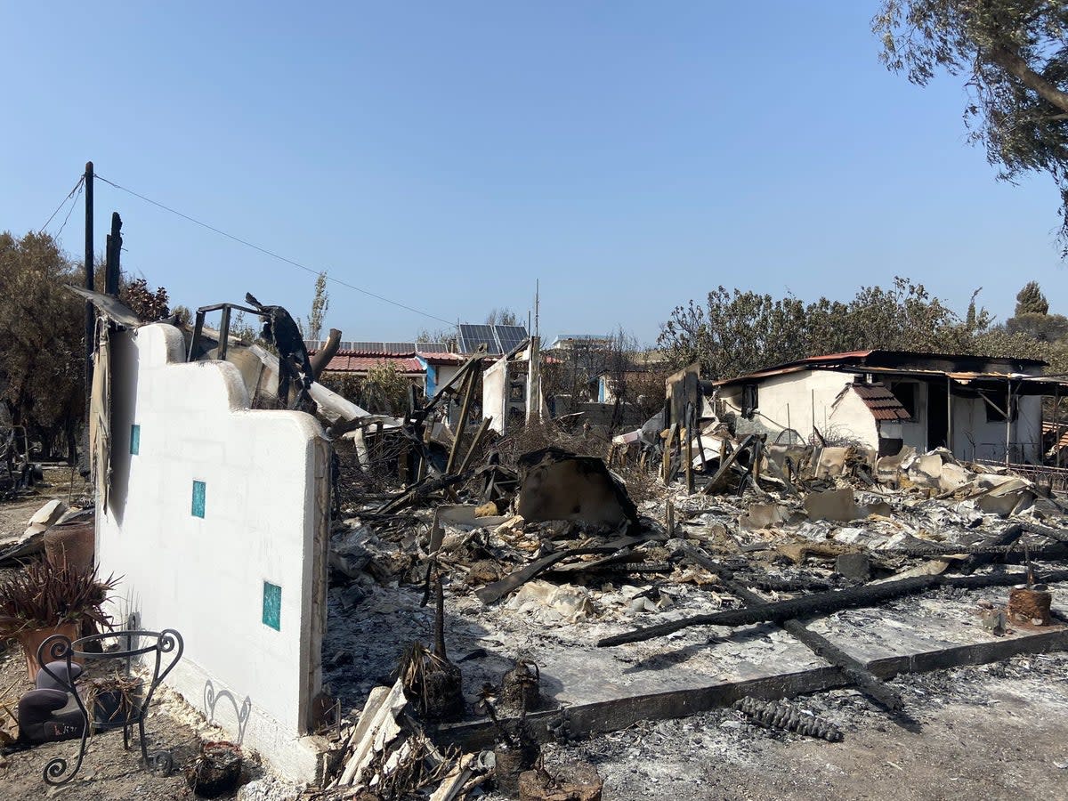 Summer shock: several houses in the Rhodes resort of Kiotari were reduced to rubble and ashes by the wildfires on the Greek island  (Andy Gregory/The Independent)