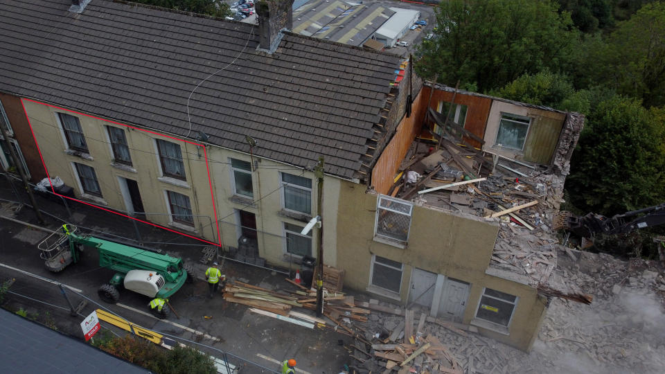 A defiant family has been left with no neighbours after refusing to move from a demolished street.

Mum-of-one Sophie Kendall, 28, grew up in the home that sits in the middle of a terraced row of houses. 

Work has begun to demolish the street after the houses were deemed at risk of a landslip in 2017.

Sophie and her family say they have had no offers from the council since their insurers have that their home is safe.


WALES NEWS SERVICE 


