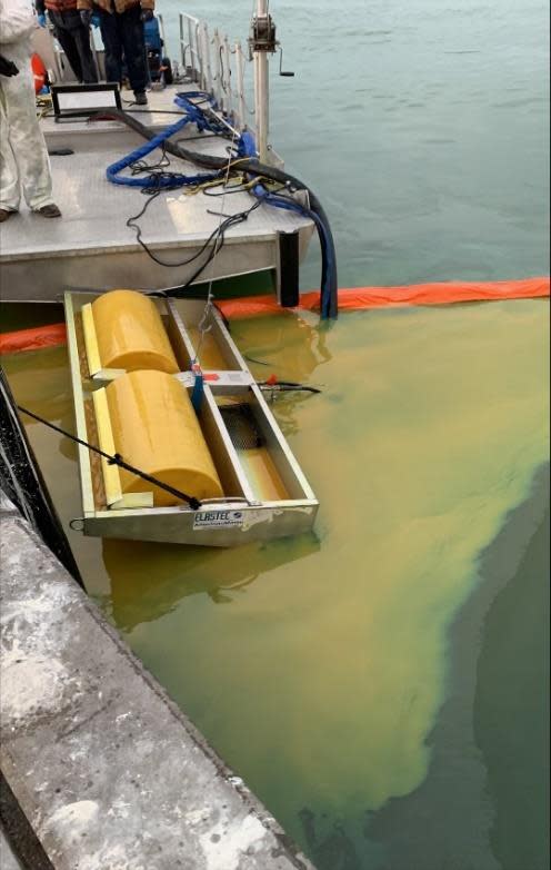 A drum skimmer removes crude oil product from the surface of water near Dock 5 of Flint Hills Resources' Ingleside terminal.