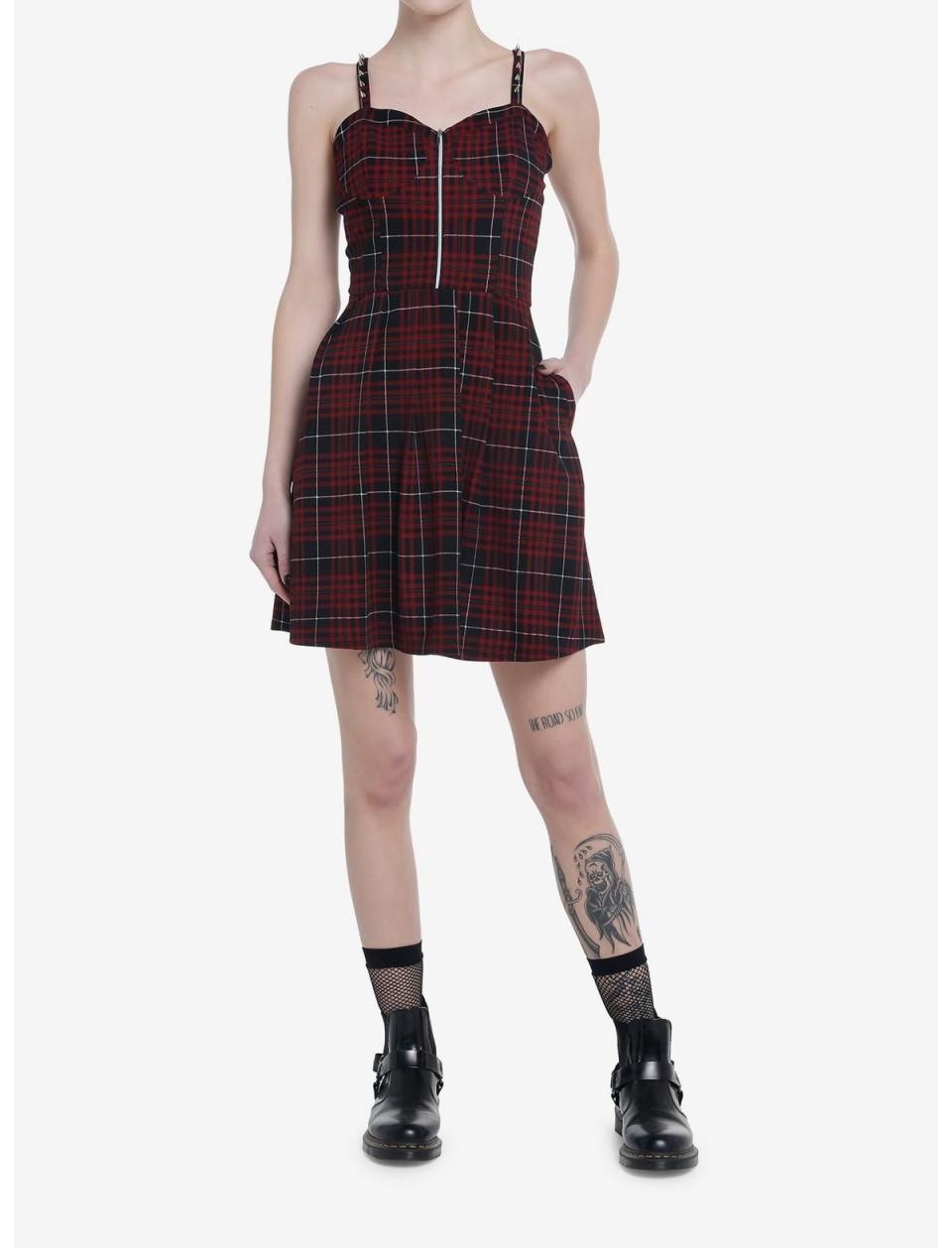 <p><a href="https://go.redirectingat.com?id=74968X1596630&url=https%3A%2F%2Fwww.hottopic.com%2Fproduct%2Fsocial-collision-black-red-plaid-spike-dress%2F19800886.html&sref=https%3A%2F%2Fwww.cosmopolitan.com%2Fstyle-beauty%2Fg44021322%2Fgrunge-aesthetic-outfits-style%2F" rel="nofollow noopener" target="_blank" data-ylk="slk:Shop Now;elm:context_link;itc:0;sec:content-canvas" class="link ">Shop Now</a></p><p>Social Collision Black & Red Plaid Spike Dress</p><p>$34.90</p><p>hottopic.com</p><span class="copyright">Hot Topic</span>