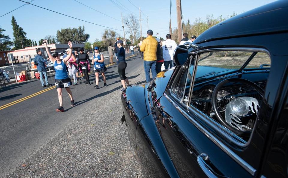 A classic car is parked on Shoemake Avenue during the Modesto Marathon in Modesto, Calif., Sunday, March 26, 2023.