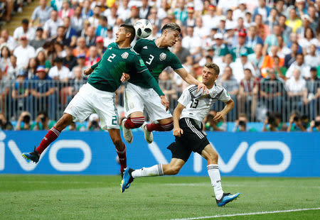 Soccer Football - World Cup - Group F - Germany vs Mexico - Luzhniki Stadium, Moscow, Russia - June 17, 2018 Mexico's Hugo Ayala and Carlos Salcedo in action with Germany's Thomas Muller REUTERS/Kai Pfaffenbach