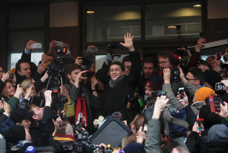 Russian protester Zhukov reacts after a court hearing in Moscow