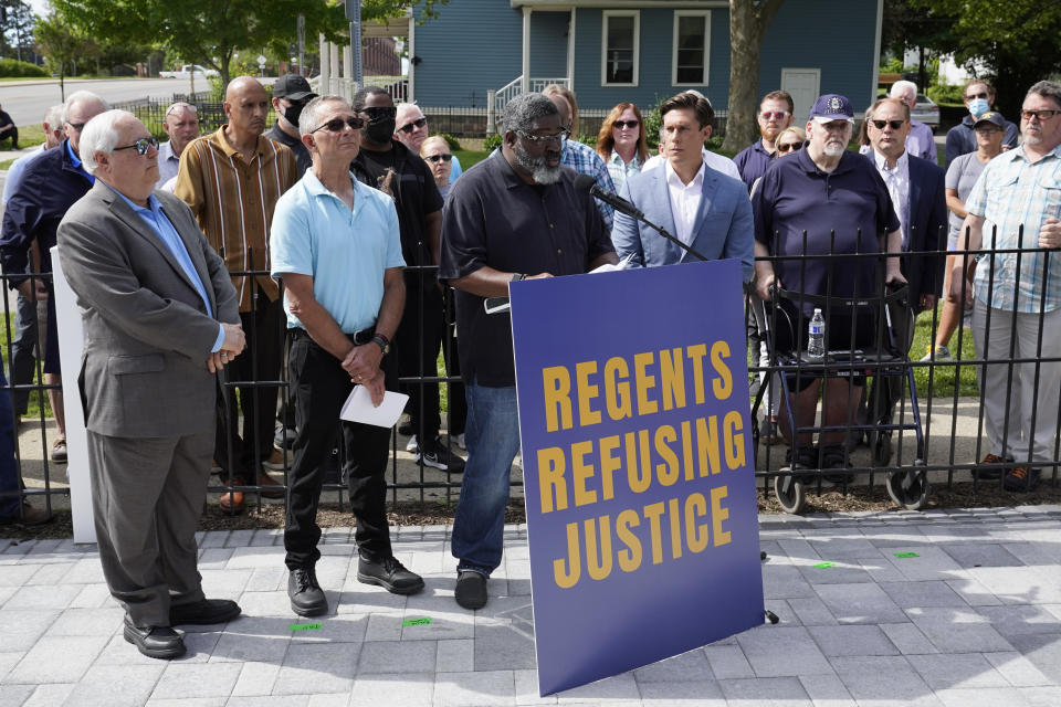 FILE - Jon Vaughn, a former University of Michigan football player from 1988 to 1991 speaks during a news conference in Ann Arbor, Mich. on June 16, 2021. A financial payout for more than 1,000 people — mostly men — who say they were sexually assaulted by former University of Michigan sports doctor Robert Anderson is the latest multimillion settlement involving schools faced with sexual misconduct scandals. (AP Photo/Paul Sancya_File)