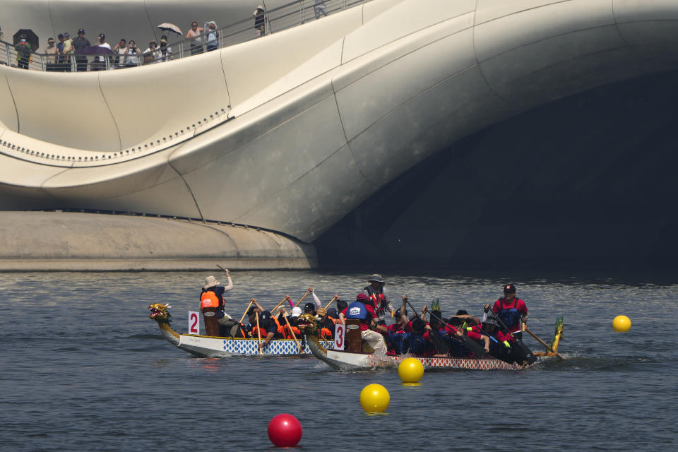 Teams of dragon boat racers paddle their boats as they compete in the Dragon Boat festival at a canal in Tongzhou, on the outskirts of Beijing, Monday, June 10, 2024. The Duanwu festival, also known as the Dragon Boat festival, falls on the fifth day of the fifth month of the Chinese lunar calendar and is marked by celebrations like eating rice dumplings and racing dragon boats. (AP Photo/Andy Wong)