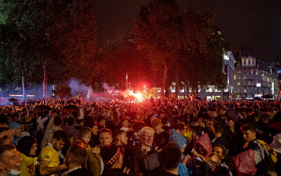  Scotland fans let off flares in Leicester Square after the England v Scotland game ended in a 0-0 draw on June 18, 2021 in London - Rob Pinney/Getty Images