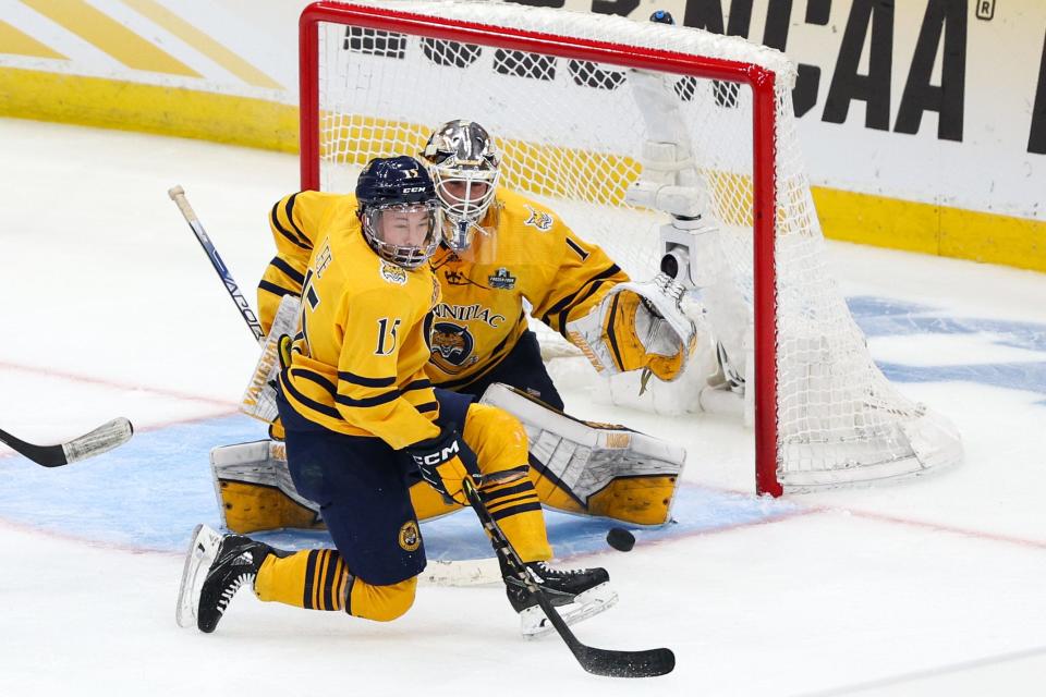 A shot from Michigan forward Adam Fantilli (19) (not pictured) goes past Quinnipiac goaltender Yaniv Perets (1) for a goal in the second period in the semifinals of the 2023 Frozen Four at Amalie Arena in Tampa, Florida, on Thursday, April 6, 2023.