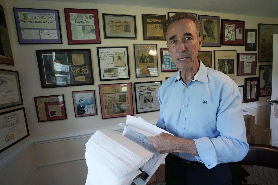 Virginia state Sen. Joe Morrissey looks over his notes from constituent visits during an interview in his office, Monday, May 22, 2023, in Richmond, Va. Morrissey is being challenged in a Democratic primary for a newly redrawn senatorial district by former Delegate Lashrecse Aird. (AP Photo/Steve Helber)