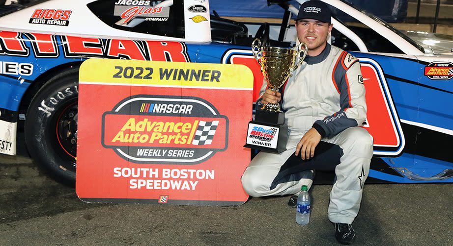 Layne Riggs displays the winner‘s trophy in Victory Lane after sweeping the NASCAR Advance Auto Parts Weekly Series Late Model Stock Car Division twinbill on July 16 at South Boston Speedway. (Joe Chandler/South Boston Speedway)