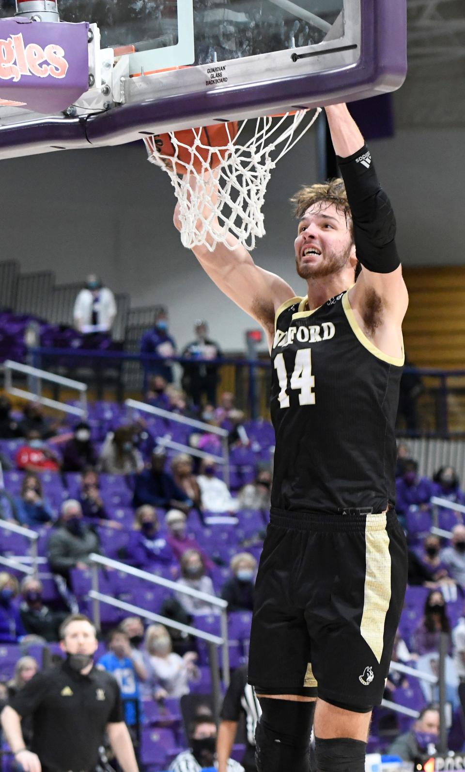 Wofford's Sam Godwin (14) dunks in the closing seconds against Furman Saturday, February 6, 2021