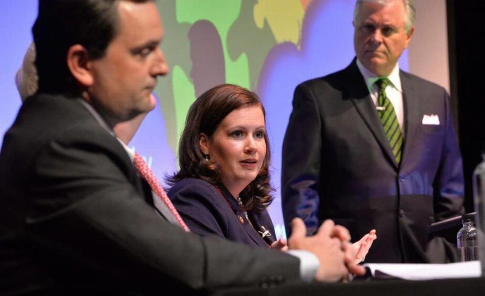 Rep. Rob Bryan, left, attends a May 2014 public forum on teacher pay along with Rep. Tricia Cotham and WBTV news anchor Paul Cameron. Bryan wants to create a pilot program that would allow charters to take over up to five struggling schools.