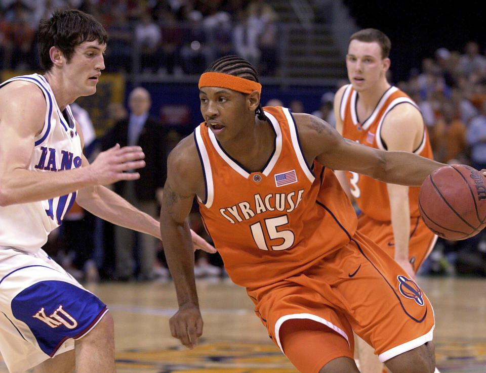 Syracuse's Carmelo Anthony (15) drives with Kansas' Kirk Hinrich (10) defending in the first half of the championship game at the Final Four Monday, April 7, 2003, in New Orleans. (AP Photo/Ed Reinke)