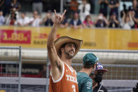 McLaren driver Daniel Ricciardo, of Australia, waves to fans before the Formula One U.S. Grand Prix auto race at the Circuit of the Americas, Sunday, Oct. 24, 2021, in Austin, Texas. (AP Photo/Darron Cummings)