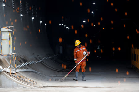 A worker sweeps inside Walini tunnel construction site for Jakarta-Bandung High Speed Railway in West Bandung regency, West Java province, Indonesia, February 21, 2019. REUTERS/Willy Kurniawan