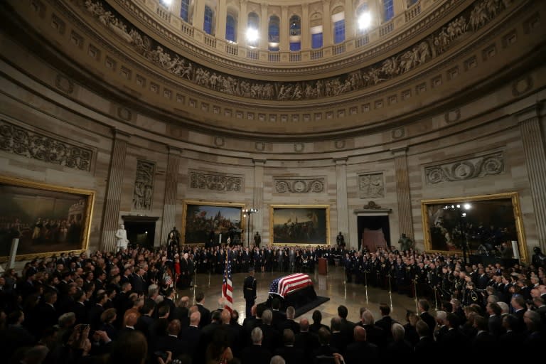 Former President George H.W. Bush's coffin lies in state in the US Capitol rotunda