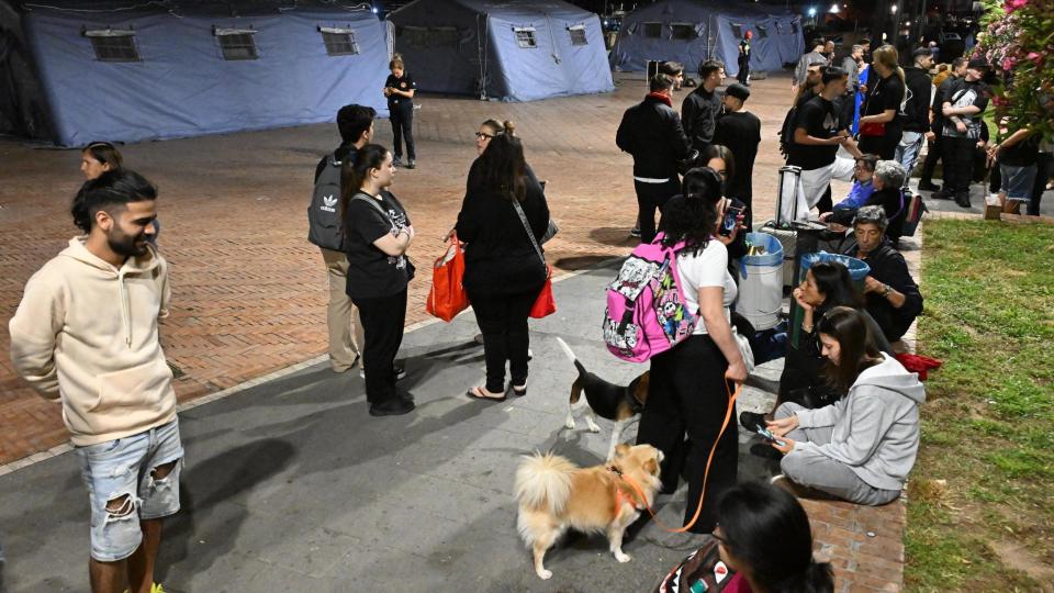 Pozzuoli residents gather near makeshift tent camps after being made to evacuate their homes